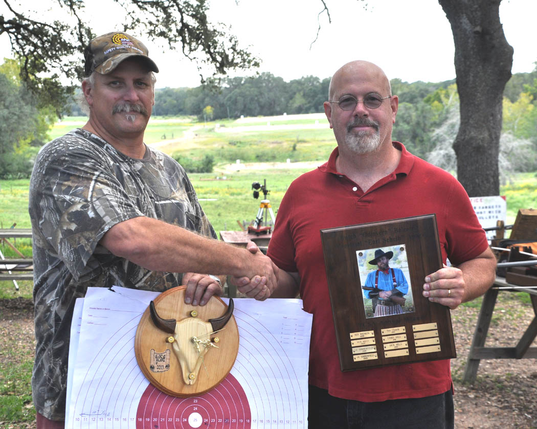 David Burger, 2013 Balcomb Award winner receives the "Earl Schieb" trophy from Dick Mills